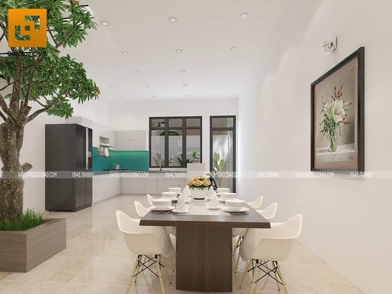 Nhà phố 3 tầng đẹp 5x17m tại Thuận An - NP20103 10 Bàn ăn đặt sau phòng khách, cạnh chân cầu thang trồng cây xanh